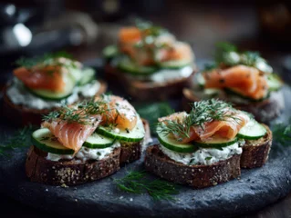 Rustic smoked salmon and cucumber crostini with herbed cream cheese, garnished with fresh dill, served on crusty artisan bread slices © britaseifert