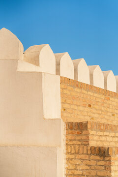 Ark of Bukhara fortress wall with crenellation in sunlight