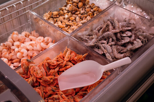 Seafood display in supermarket freezer section