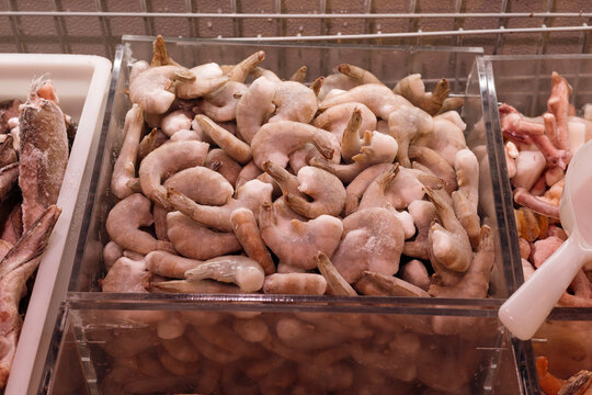 Frozen shrimp display in supermarket seafood section