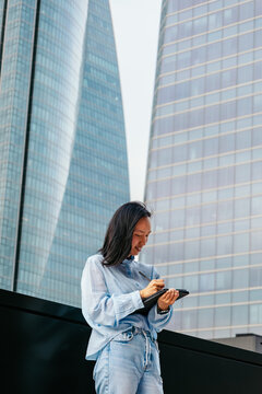 Businesswoman using a digital tablet in urban setting