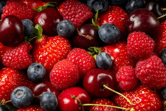 Fresh berry mix background with strawberry, raspberry, cherry