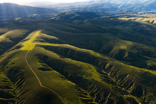 Aerial spring badlands landscape in magical golden light