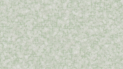 Fototapeta premium A close up view of a light green background with white bokeh.