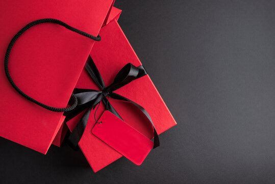 Red shopping bag with gift box for Black Friday sales
