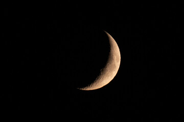 Crescent moon against black night sky © VacationLand