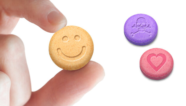 MDMA or Ecstasy pills on white background. Addiction concept.
