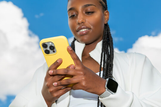 Gen Z athlete checking fitness app on phone outdoors