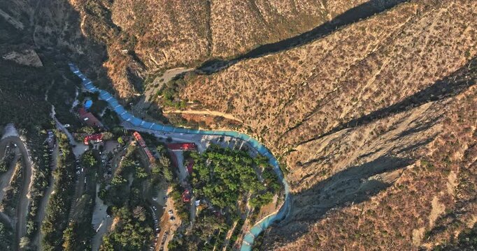 Tolantongo Mexico Aerial v5 birds eye view drone flyover natural hill of hidalgo capturing the canyon and hot springs thermal river - Shot with Mavic 3 Cine - December 2021