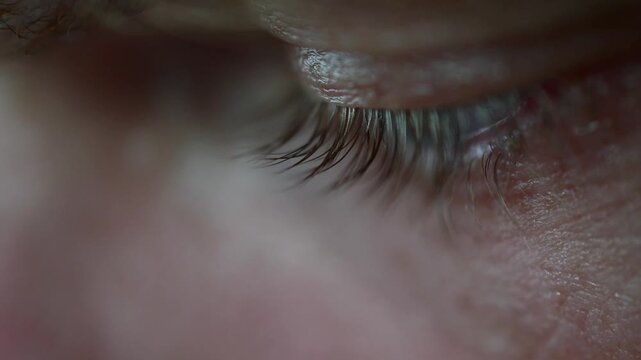 Macro close up cinematic off focus bokeh video, abstract artistic, emotion, human body, vivid men blue eye's 