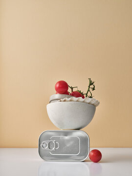 Creative still life with tomatoes and canned food