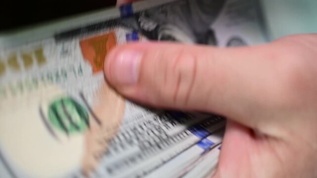 abstract close up counting money, finance, 100 dollars bills, bokeh, selective focus background video