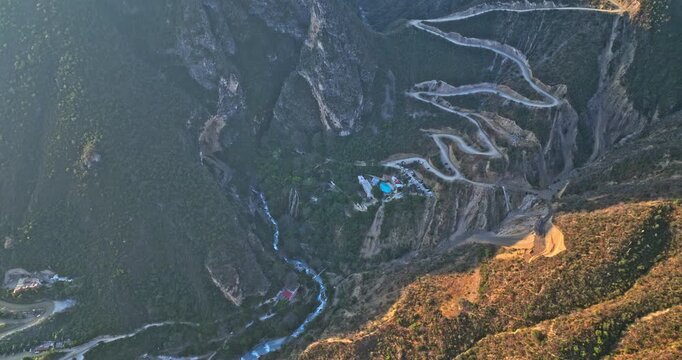 Tolantongo Mexico Aerial v6 vertical birds eye view drone flyover secluded canyon capturing the touristic hot springs river and mountain landscape - Shot with Mavic 3 Cine - December 2021