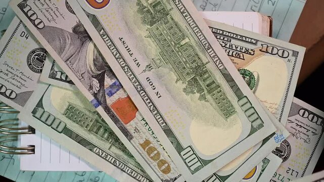 abstract close up counting money, finance, 100 dollars bills, bokeh, selective focus background video