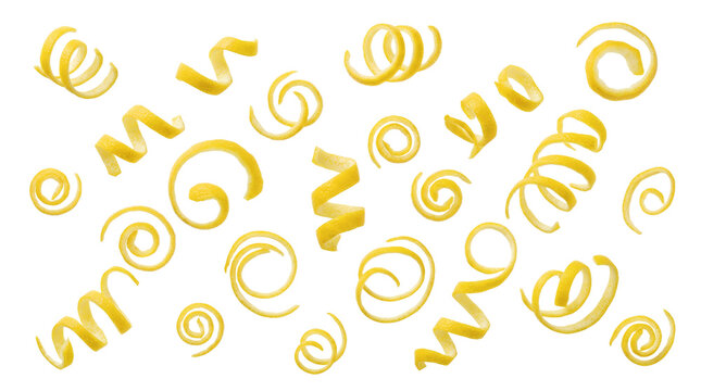 Falling lemon zest twists and spirals isolated on white background. Fresh yellow citrus peel garnish for food recipes.