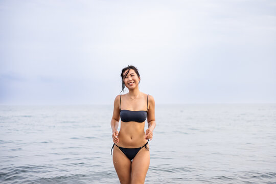 Woman enjoying a serene day at the seaside