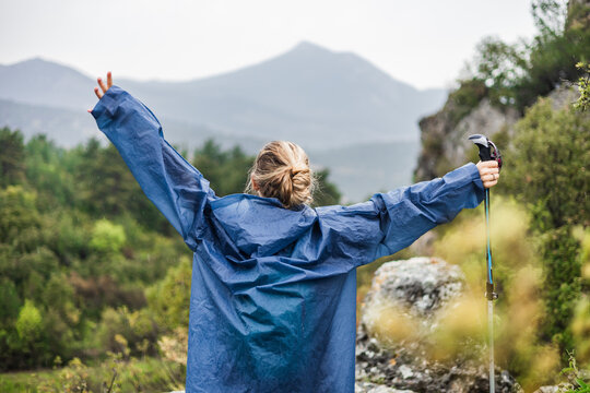 Woman embraces nature on a mountain hike