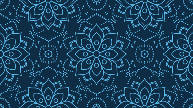 Seamless pattern with blue floral mandala motifs and dotted lines on a dark blue background