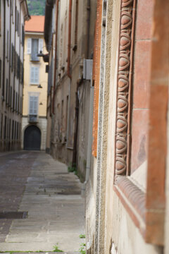 Fascinating old historical palace and narrow stone streets near the sunny lakefront of Lake Como Italy