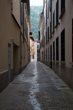 Fascinating old historical palace and narrow stone streets near the sunny lakefront of Lake Como Italy