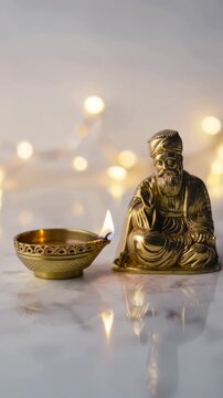 Golden sikh devotional statue beside an oil lamp flame, gurpurab prayer setting, brass diya reflection, sacred remembrance, kirtan atmosphere, langar seva spirit, soft bokeh festive glow