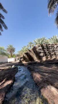 Crystal clear stream in The Garden of Salman Al Farsi (RA) in Madinah, Saudi Arabia.