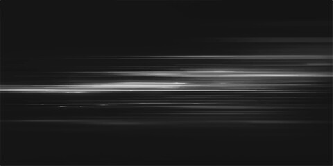 Abstract light trails in monochrome create a dynamic and futuristic motion blur effect, hinting at speed and technology in the darkness. © jaduuu