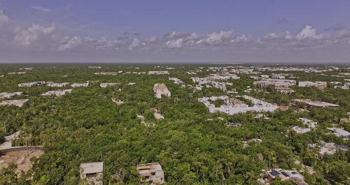 Tulum Mexico Aerial v30 flyover the outer town capturing luxury neighborhood with exclusive residential buildings, La Veleta town and lush jungle surroundings - Shot with Mavic 3 Pro Cine - July 2023