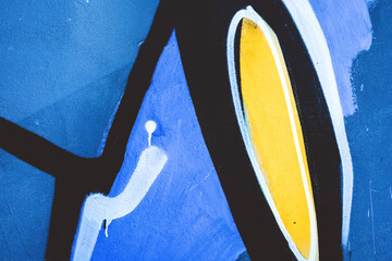 Fototapeta premium Urban graffiti wall in blue, yellow, black colors, 90s, Y2K style, street art, grungy texture. Posters, digital art, social media, modern 90s, 2000s, y2k creative banner, summer visuals.
