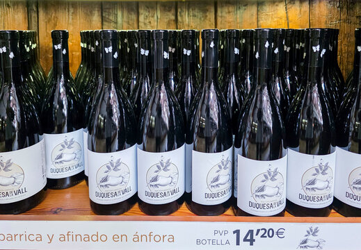 XALO, SPAIN - JUNE 20, 2026.Elegant dark glass bottles of Duquesa de la Vall red wine sit on display at Bodegas Xal&oacute; in Spain showcasing quality and tradition