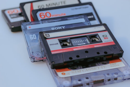 MINNEAPOLIS, USA - JULY 1, 2026: A close-up view of vintage 60-minute analog audio cassette tapes from Maxell, Sony, SIM and other brands. Editorial Use Only.
