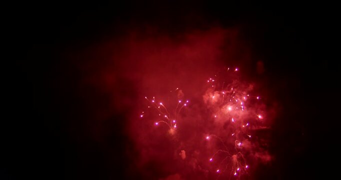 Red Fireworks Exploding In Smoky Night Sky On Independence Day