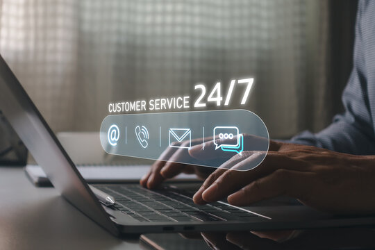 Businessman using laptop with 24/7 customer service interface, representing online technical support, help desk, live chat, email assistance, contact center, customer experience, digital communication