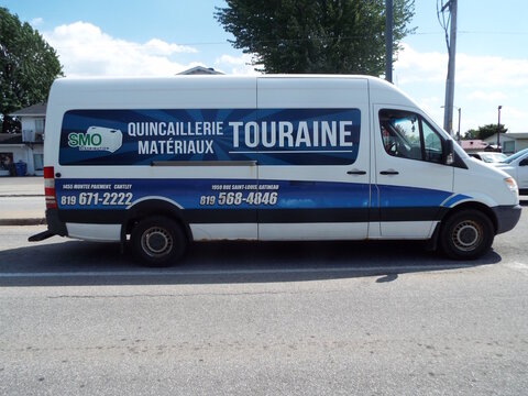 Gatineau,Quebec, Canada &ndash; May 24, 2026:A white delivery van for "Quincaillerie Touraine" displays its business name and contact information in French on the side on Chem. de la Savane.