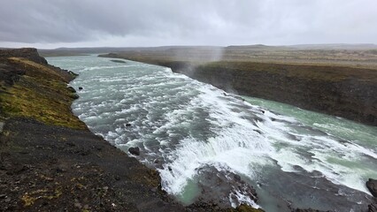 Fototapeta premium Goðafoss Waterfall and Volcanic River Landscape in North Iceland