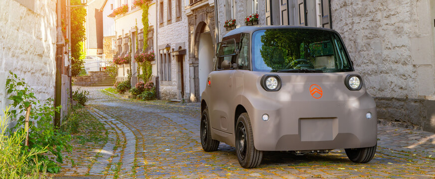 New 2026 Citroen Ami electric microcar parked in a small french town