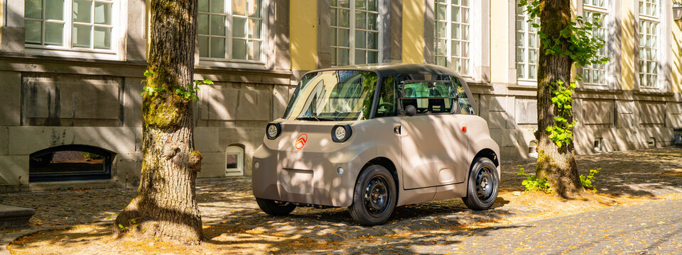 New 2026 Citroen Ami electric microcar parked in a small french town