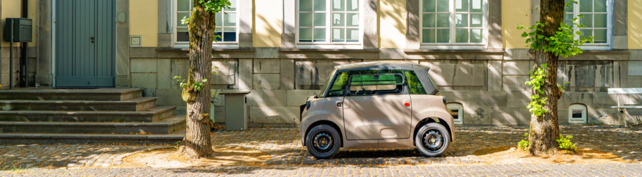 New 2026 Citroen Ami electric microcar parked in a small french town