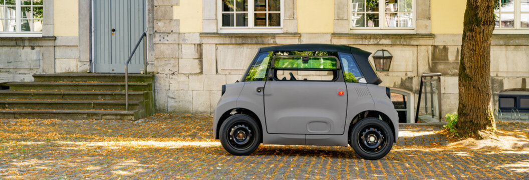 New 2026 Citroen Ami electric microcar parked in a small french town