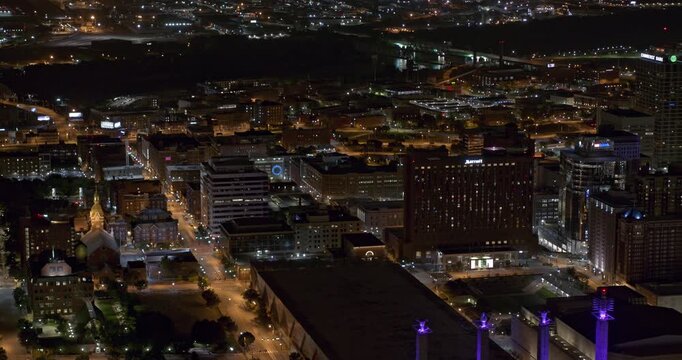 Kansas City Missouri Aerial v12 tracking right shot capturing shimmering reflective high rise buildings and night cityscape in downtown - Shot with Inspire 2, X7 camera - August 2020