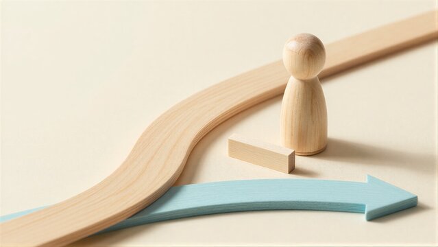 Wooden figure stands at crossroads, choosing path forward with blue arrow symbolizing direction.