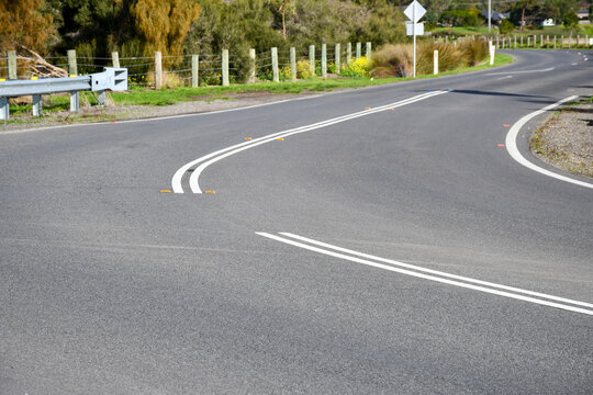 curving road with double lines for no overtaking