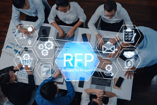 Collaborative Business Meeting with RFP Concept Displayed on Table Showing Team Discussing Proposal Strategy and Project Planning. Bitwise.