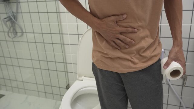 Constipation and diarrhea in bathroom. Hurt man touch belly  stomach ache painful. colon inflammation problem, toxic food, abdominal pain, abdomen, constipated in toilet, stomachache, Hygiene