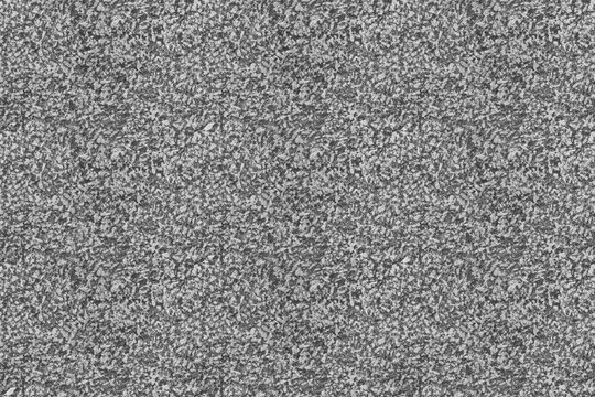 Granite stone surface seamless texture background top view. Natural mineral stone grain pattern. Typical grey floor or countertop interior building design.