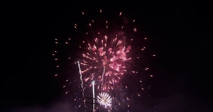Purple and Gold Firework Burst Above Power Lines In Night Sky In Provo Utah