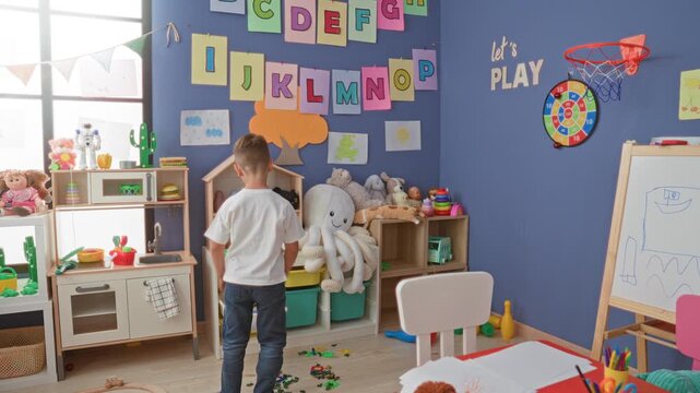 Boy reaches with arm raised toward scattered toys and plush octopus on storage shelves in a colorful playroom building; playful imagination.