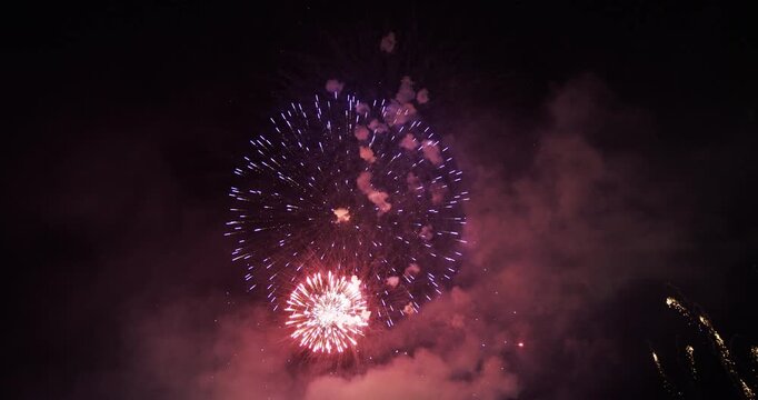 Colorful Fireworks Bursting in Night Sky with Smoke In Provo, Utah
