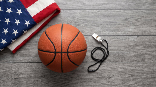 Basketball and coach whistle with american flag on wooden background