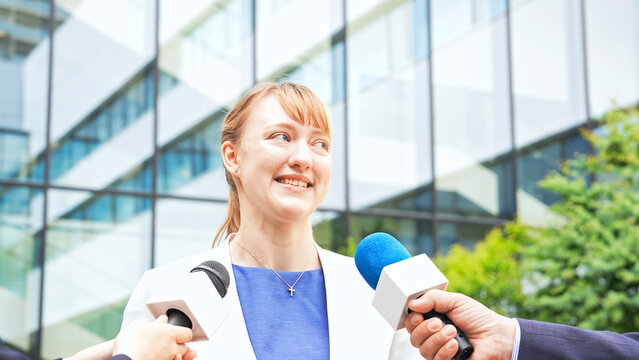 A caucasian woman being interviewed